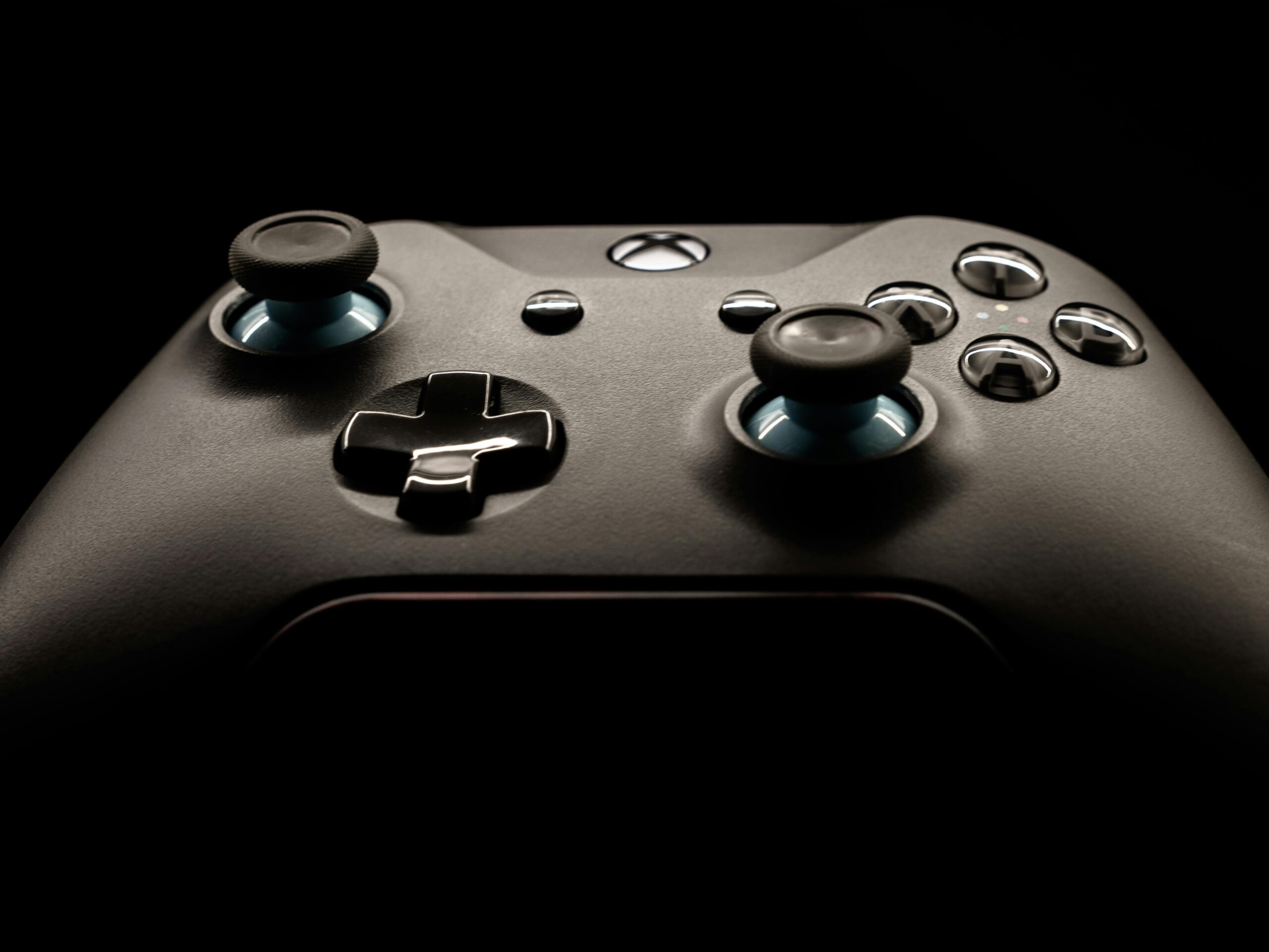 A detailed close-up of a modern gaming controller highlighting its design and functionality.